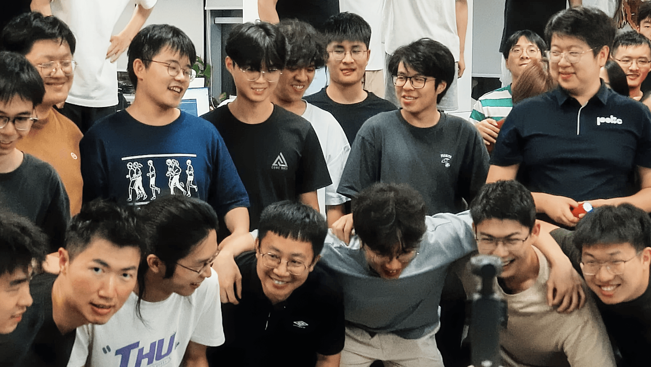 Poke interns and team members posing together for a summer group photo